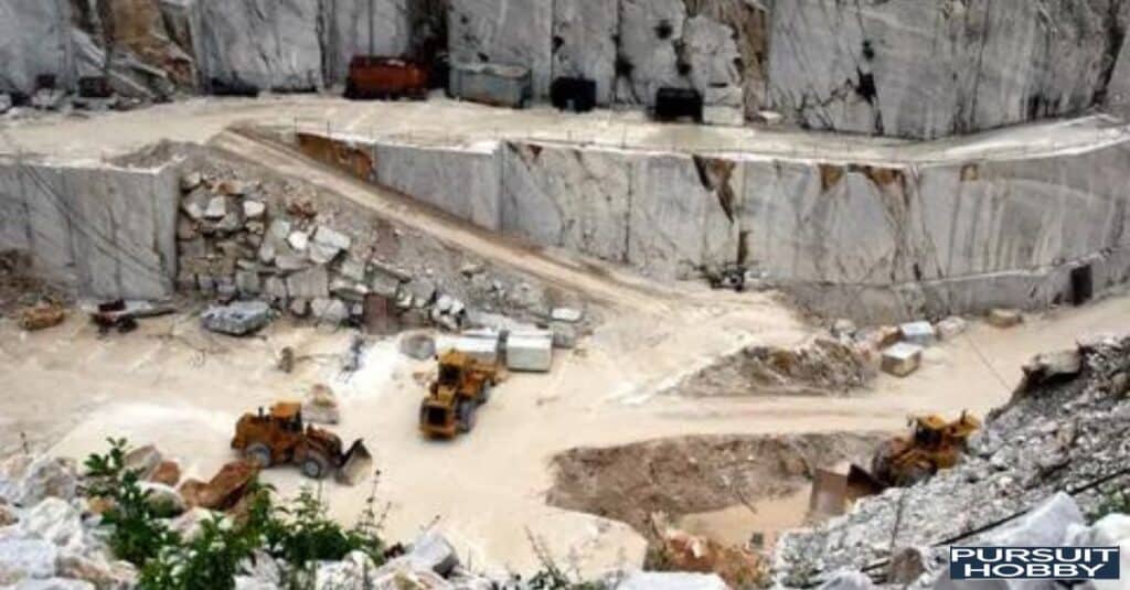 Machinery cutting large marble slabs.